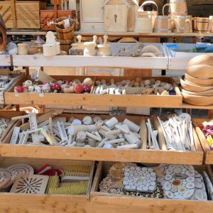 handcrafted wooden items for sale at outdoor market